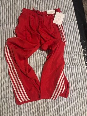 Red Track Pants with White Side Stripes